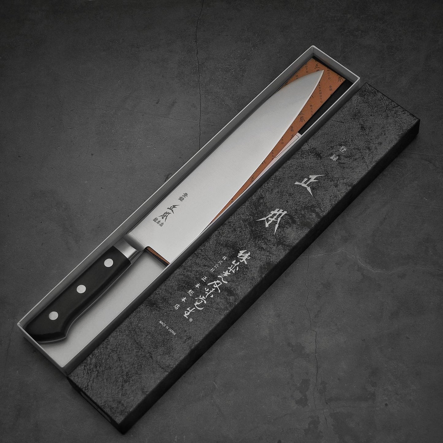 Top view of Masamoto VG yo-gyuto knife in its box