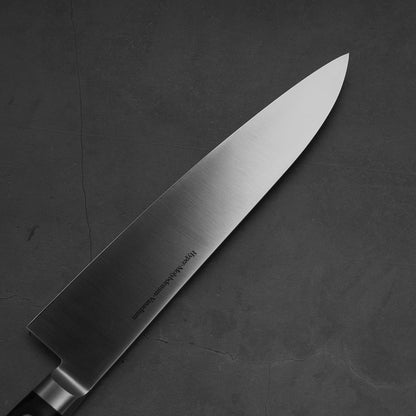 Close up view of the blade of Masamoto VG yo-gyuto knife. Image shows left side