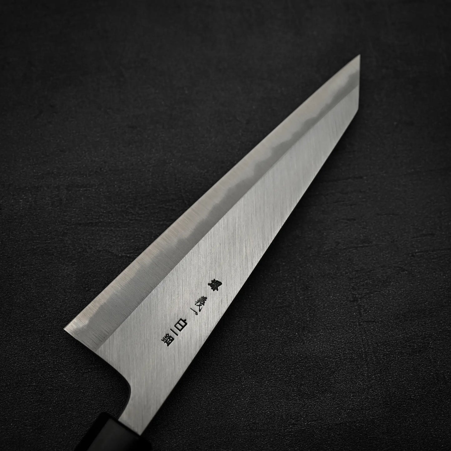 Close up view of the back side of Yoshikazu Tanaka shirogami#1 double bevel honesuki knife