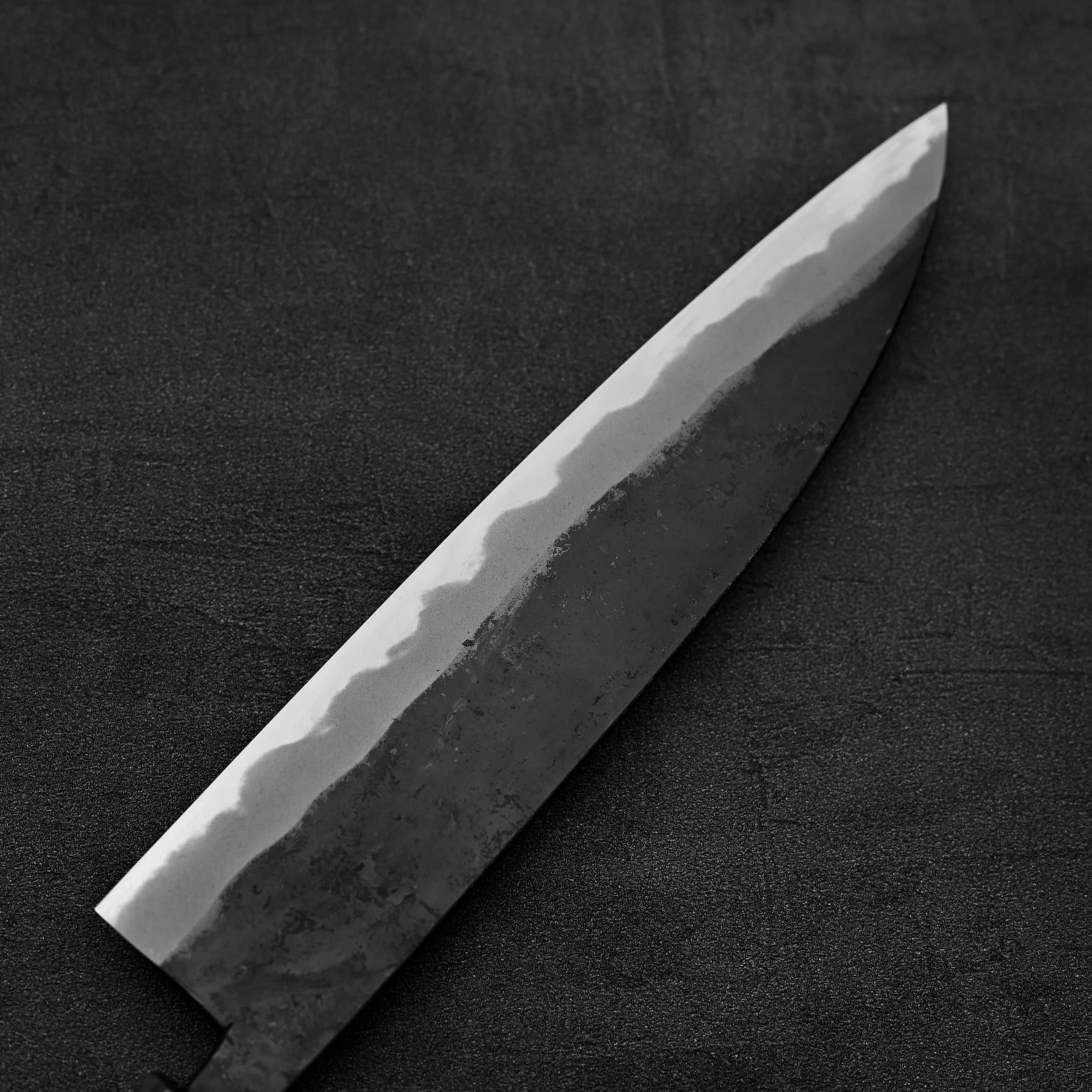 Back side view of the blade of Hinokuni kurouchi shirogami#1 gyuto knife