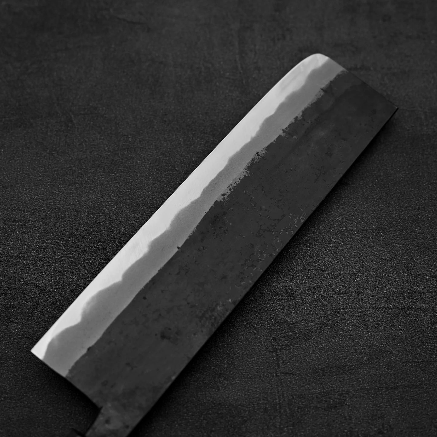 Back side of the blade of Hinokuni kurouchi shirogami#1 nakiri knife
