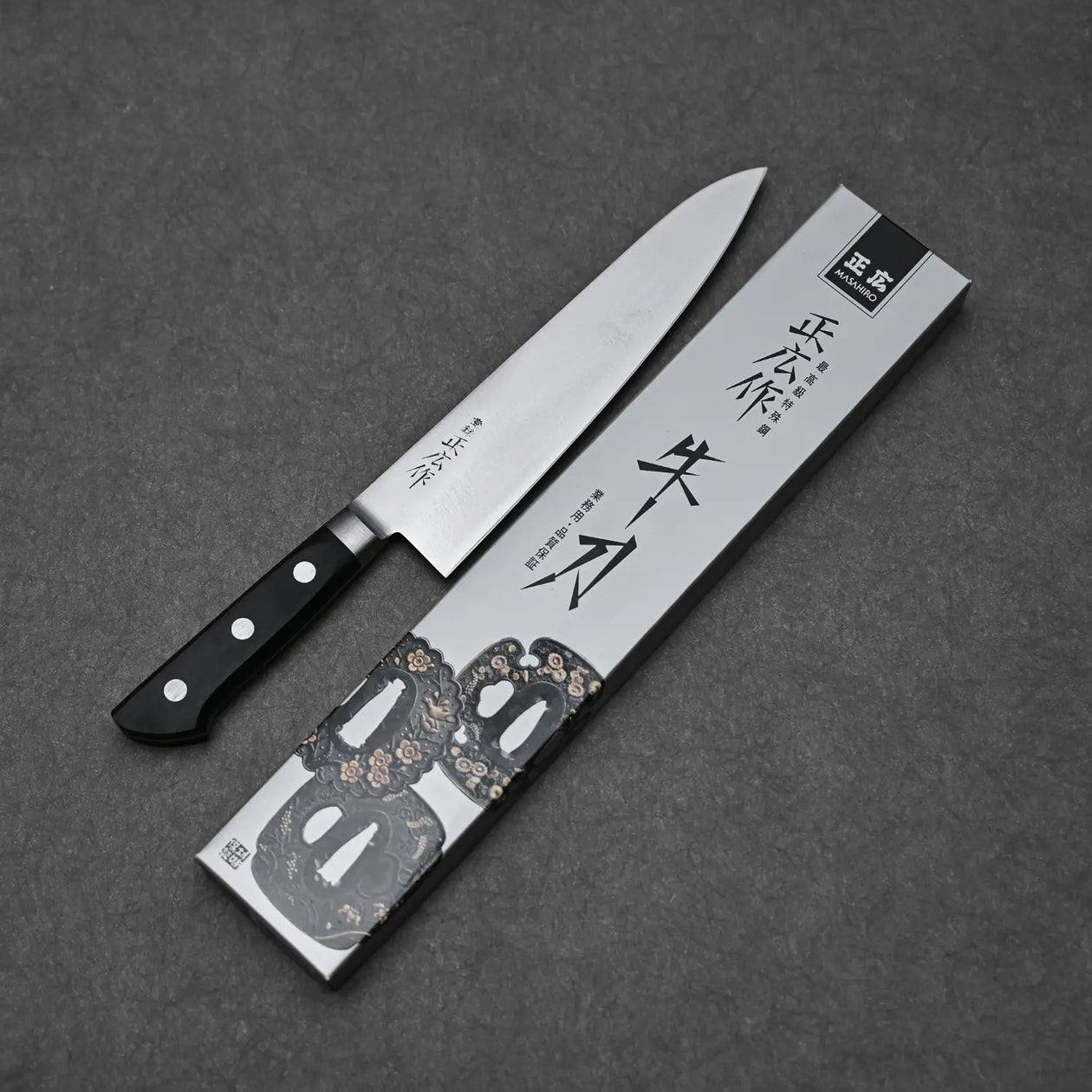 Complete blade profile of the 210mm Masahiro chef's knife with its box