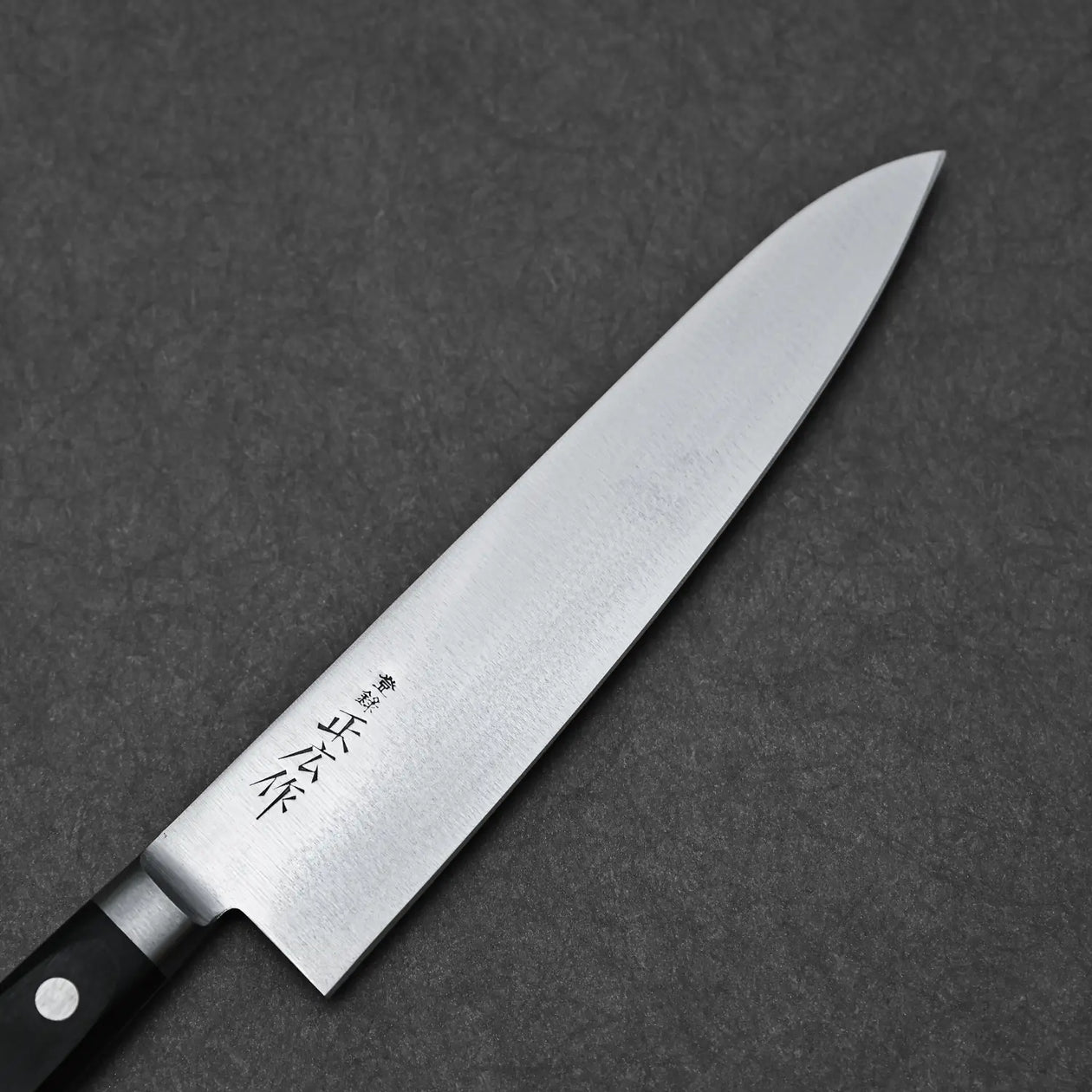 Close-up of the Masahiro blade showing the migaki finish and maker's mark