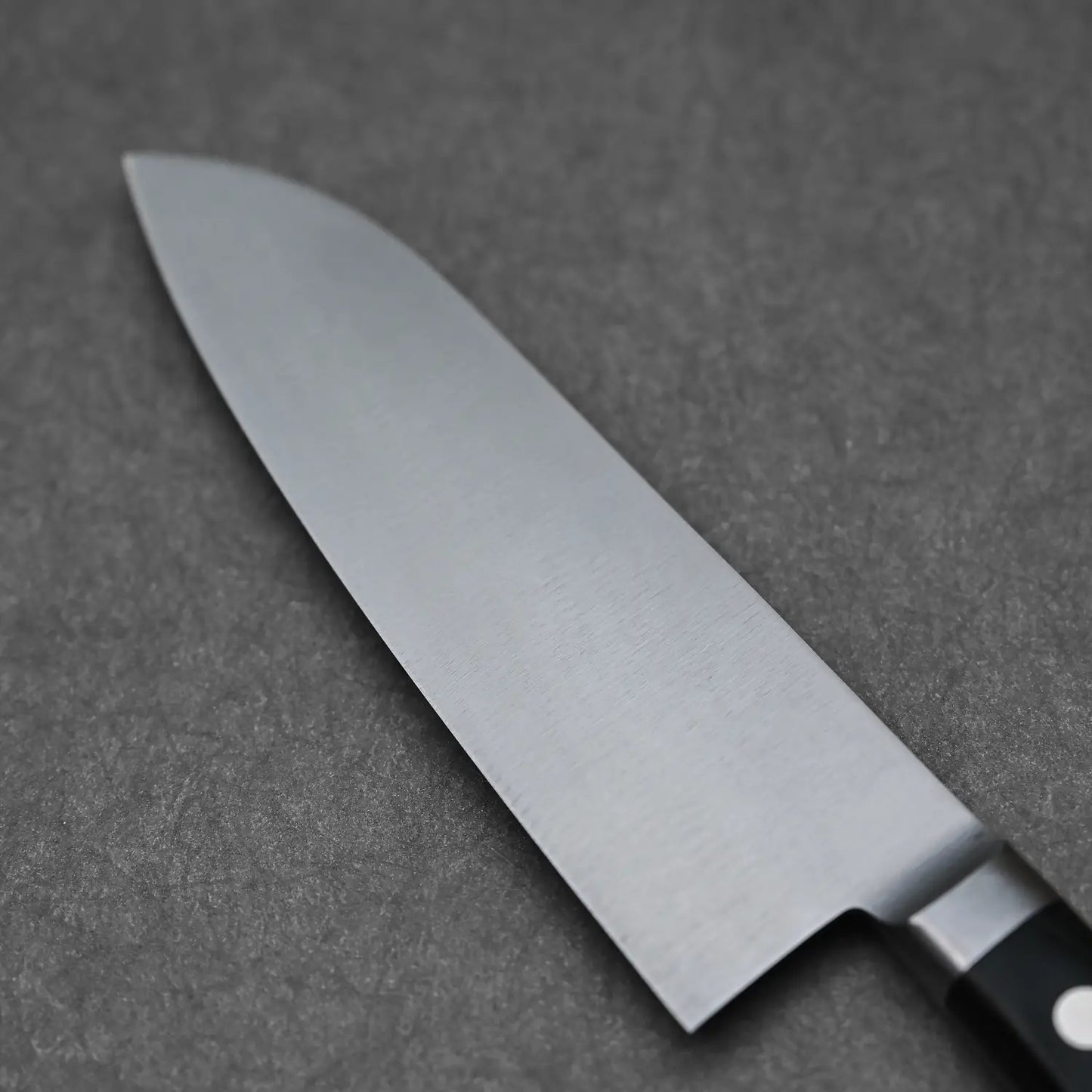 Close-up of the back side of the blade of the Masahiro santoku knife
