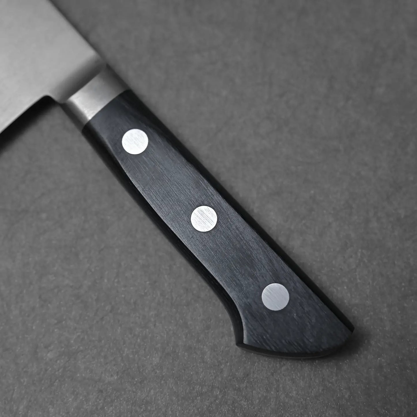 Close-up shot of the Masahiro handle made of reinforced wood