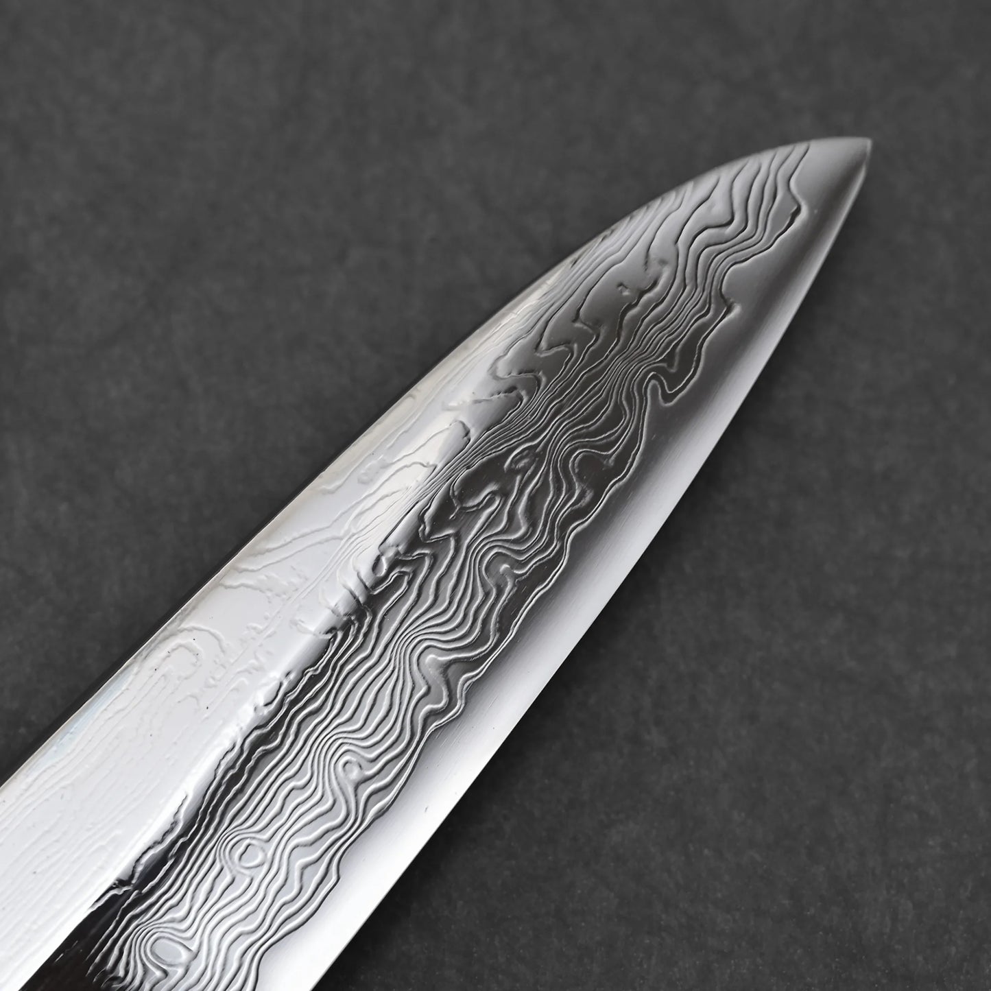 Close-up shot of the tip area of 210mm Nakagawa SPG STRIX damascus gyuto knife