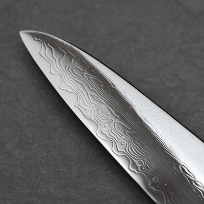 Close-up shot of the tip area of 210mm Nakagawa SPG STRIX damascus gyuto knife on the left side