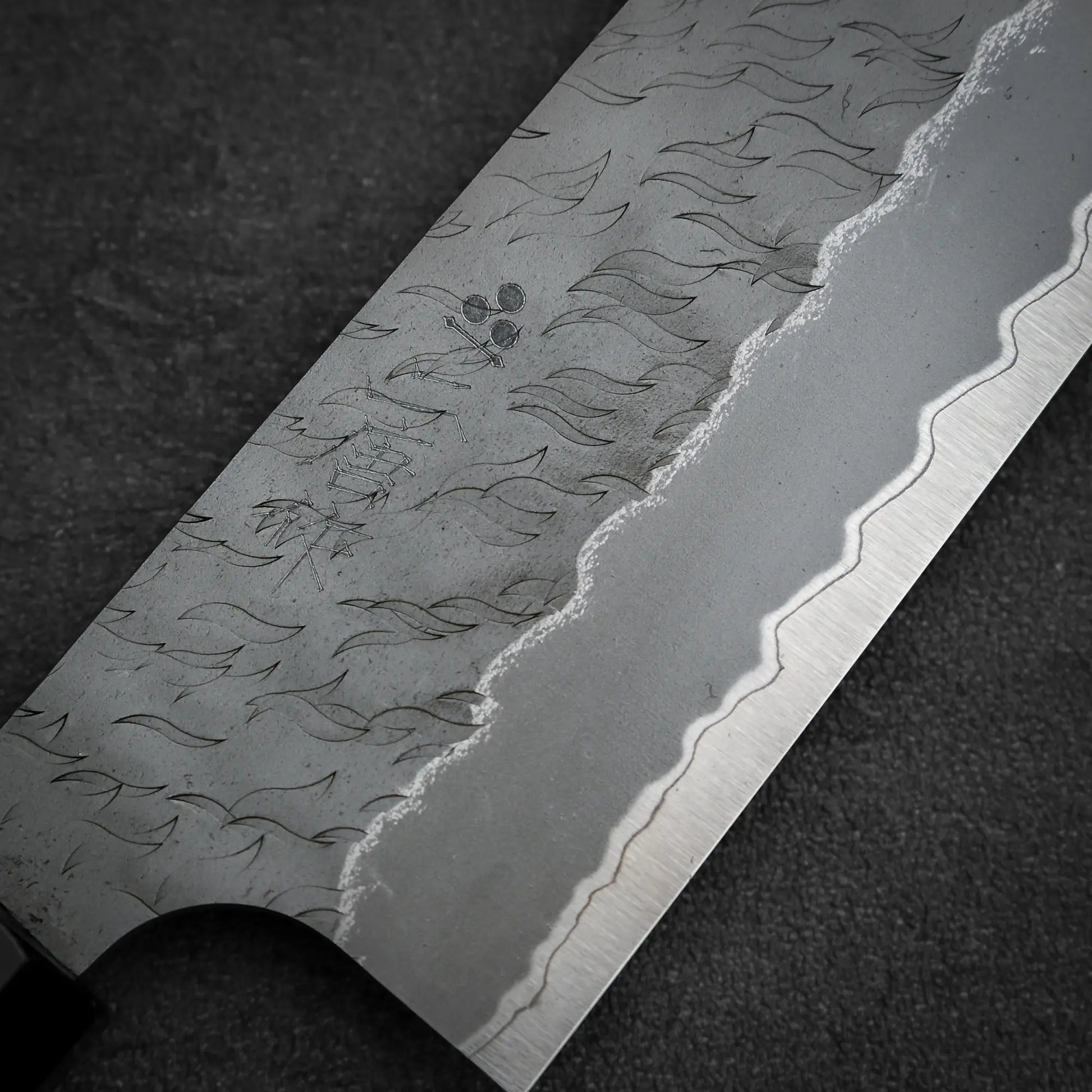 Macro shot of the front side of Nigara tsuchime AS gyuto knife