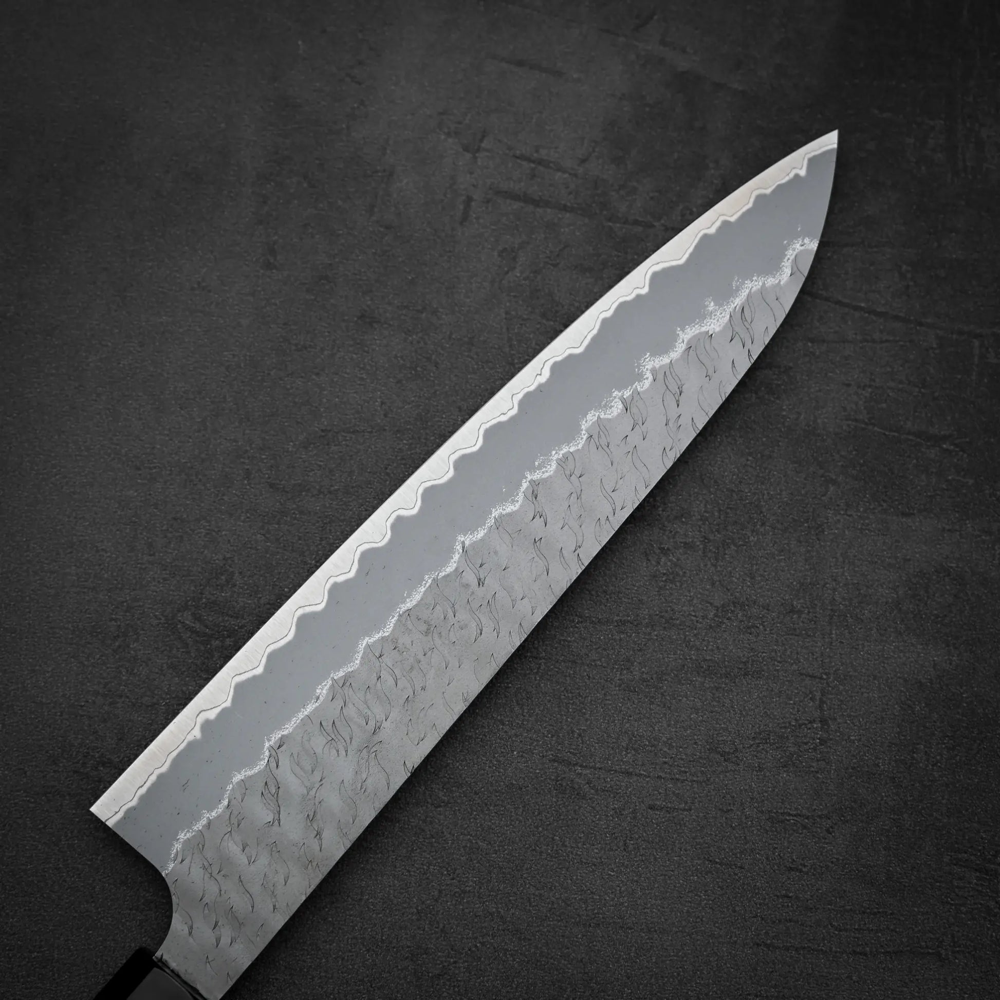 Close up shot of the back side of Nigara tsuchime AS gyuto knife