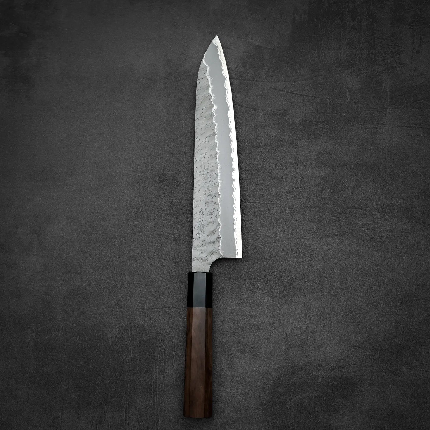 Top down view of Nigara tsuchime AS gyuto knife in vertical position