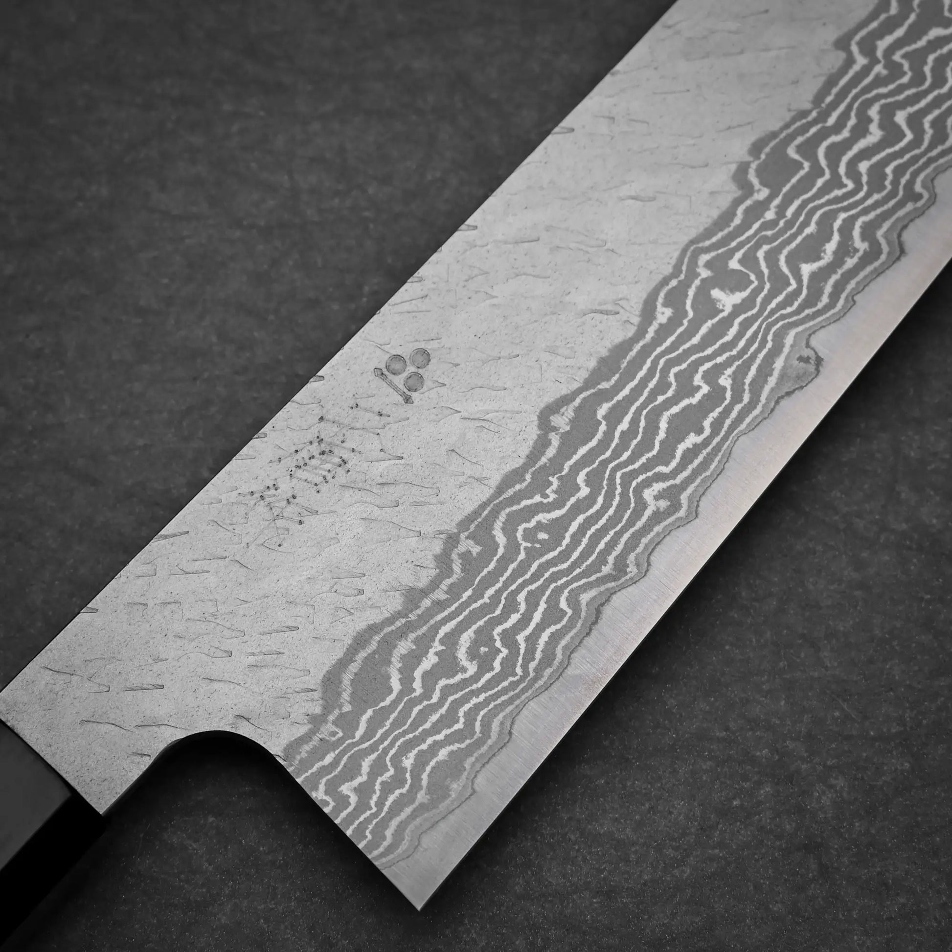 Close-up view of 210mm Nigara tsuchime damacsus VG10 gyuto knife main side view