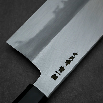 Close-up shot of the kanji of Nakagawa knife aogami#1 210mm nakiri on the back side