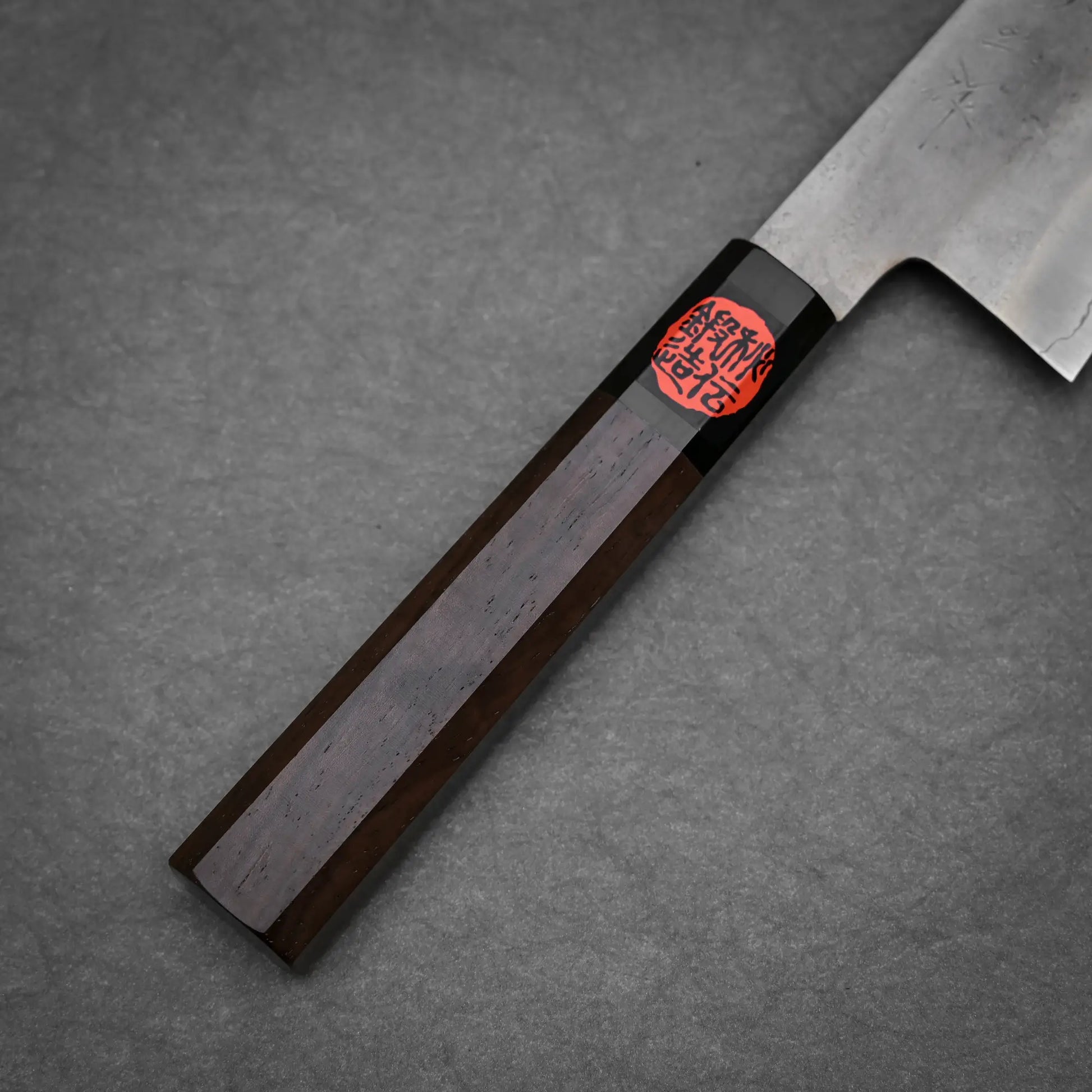 Close-up view of the handle of 240mm Shigeki Tanaka nashiji ginsan gyuto knife