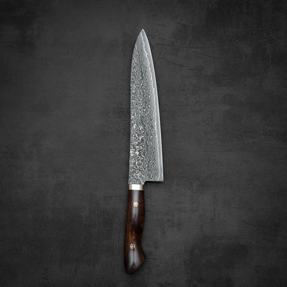 Top down view of 240mm Shigeki Tanaka R2 damascus ironwood gyuto knife in vertical position