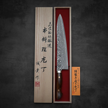 Top down view of 270mm Shigeki Tanaka R2 damascus ironwood gyuto knife with its kiri box