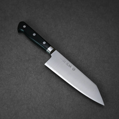 A Takamura VG10 bunka 170mm Japanese knife with a black handle and three rivets rests on a dark textured surface. The wide VG10 steel blade has Japanese characters engraved near the handle. 