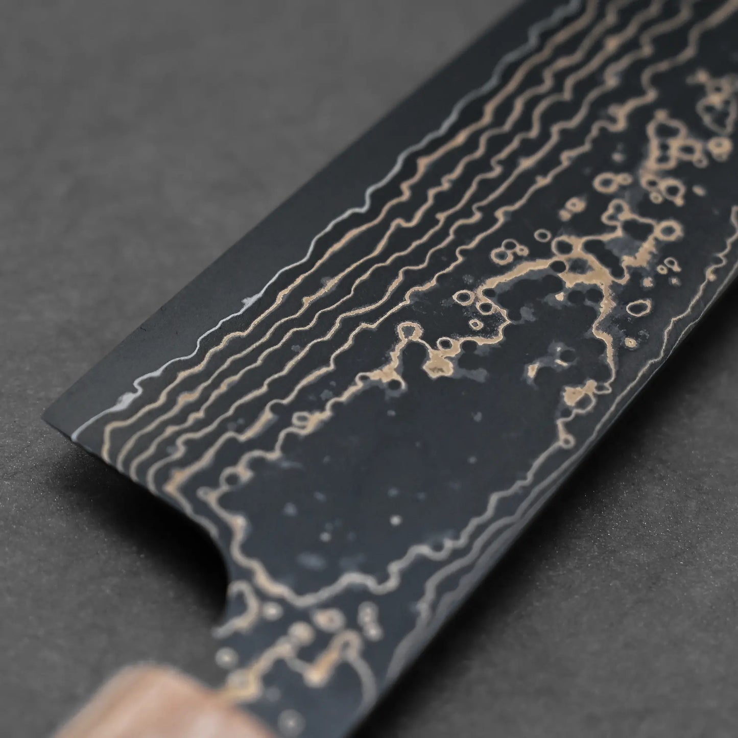 Close-up shot of the back side of 210mm Takeshi Saji knife VG10 Gold damascus gyuto