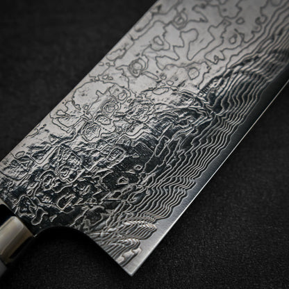 Macro shot of the front side of Takeshi Saji R2 diamond damascus gyuto knife