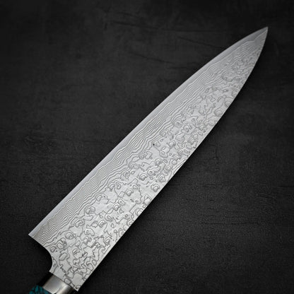 Close up shot of the back side of Takeshi Saji R2 diamond damascus gyuto knife