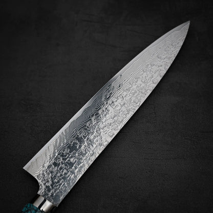 Close up shot of the back side of Takeshi Saji R2 diamond damascus gyuto knife showcasing the patterns