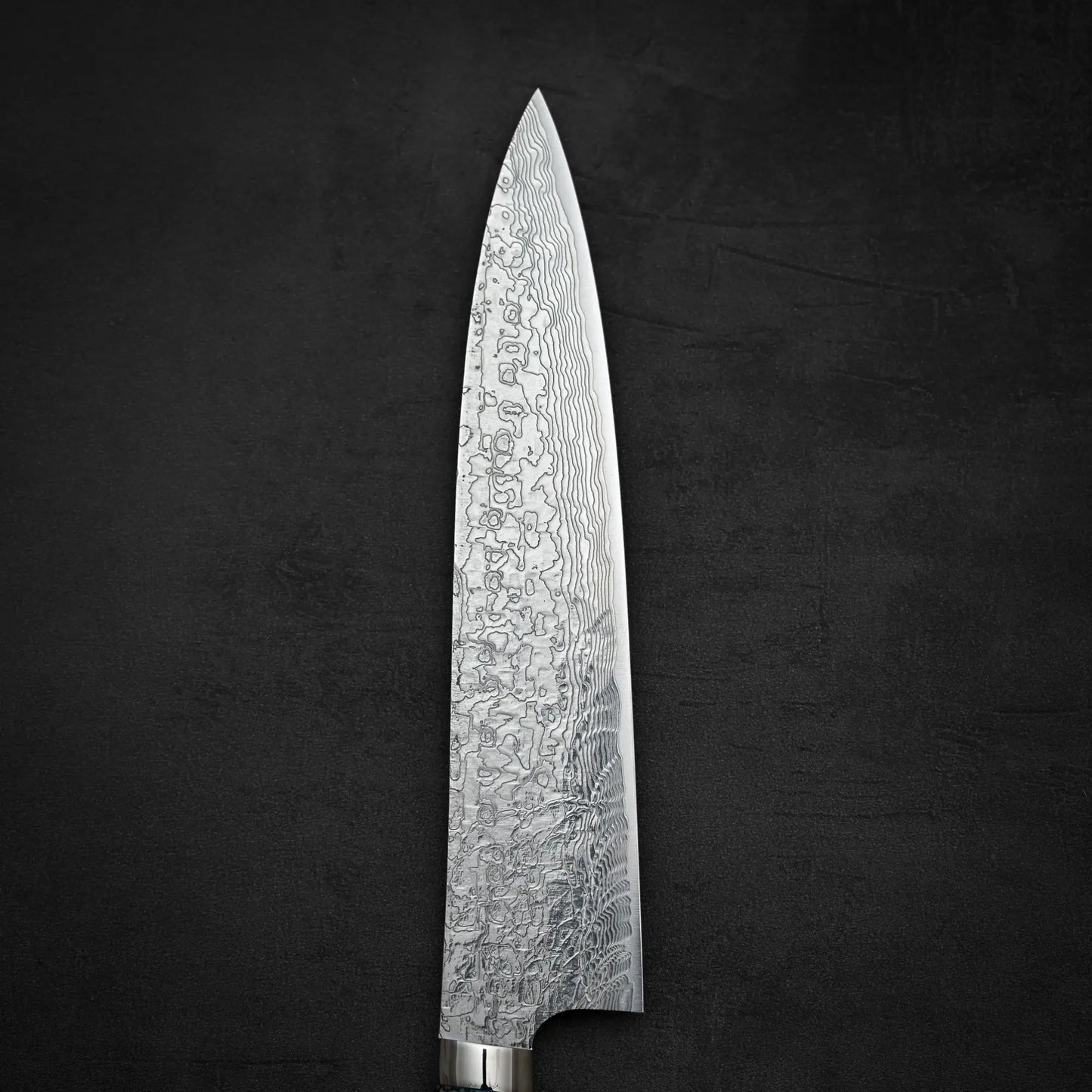 Top down view of the front side of Takeshi Saji R2 diamond damascus gyuto knife