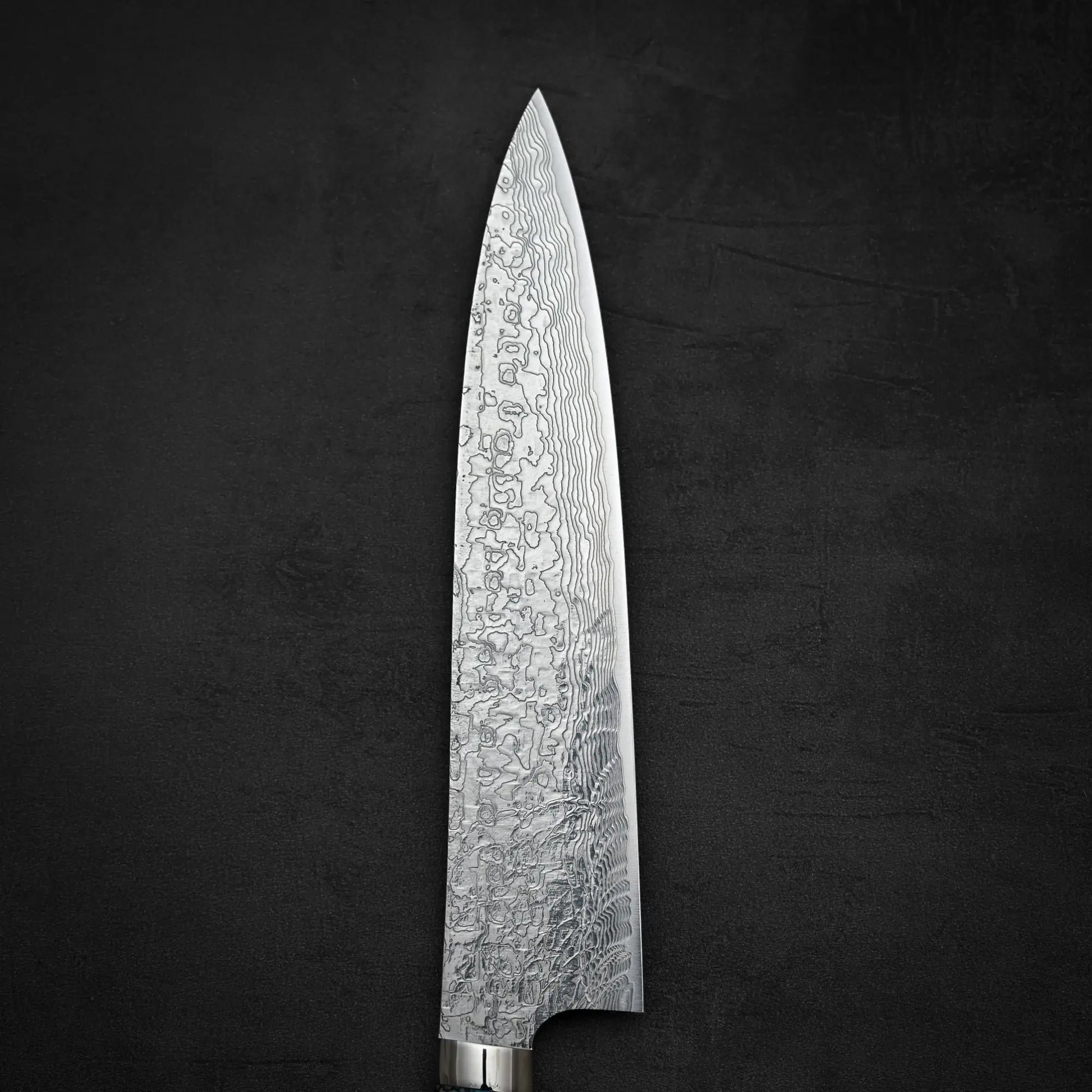 Top down view of the front side of Takeshi Saji R2 diamond damascus gyuto knife