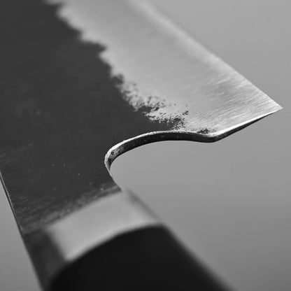 Close-up shot of the choil finish of Teruyasu Fujiwara 240mm Denka gyuto knife