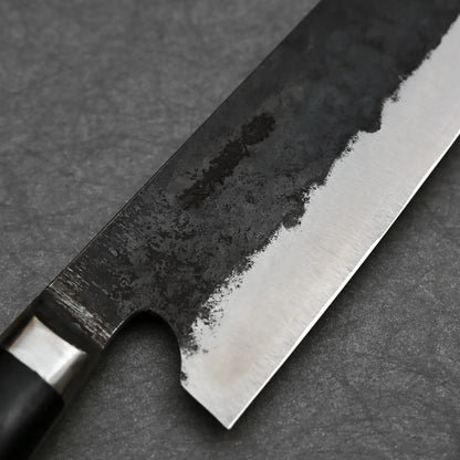 Close-up shot of Teruyasu Fujiwara 240mm Denka gyuto knife showing maker's mark