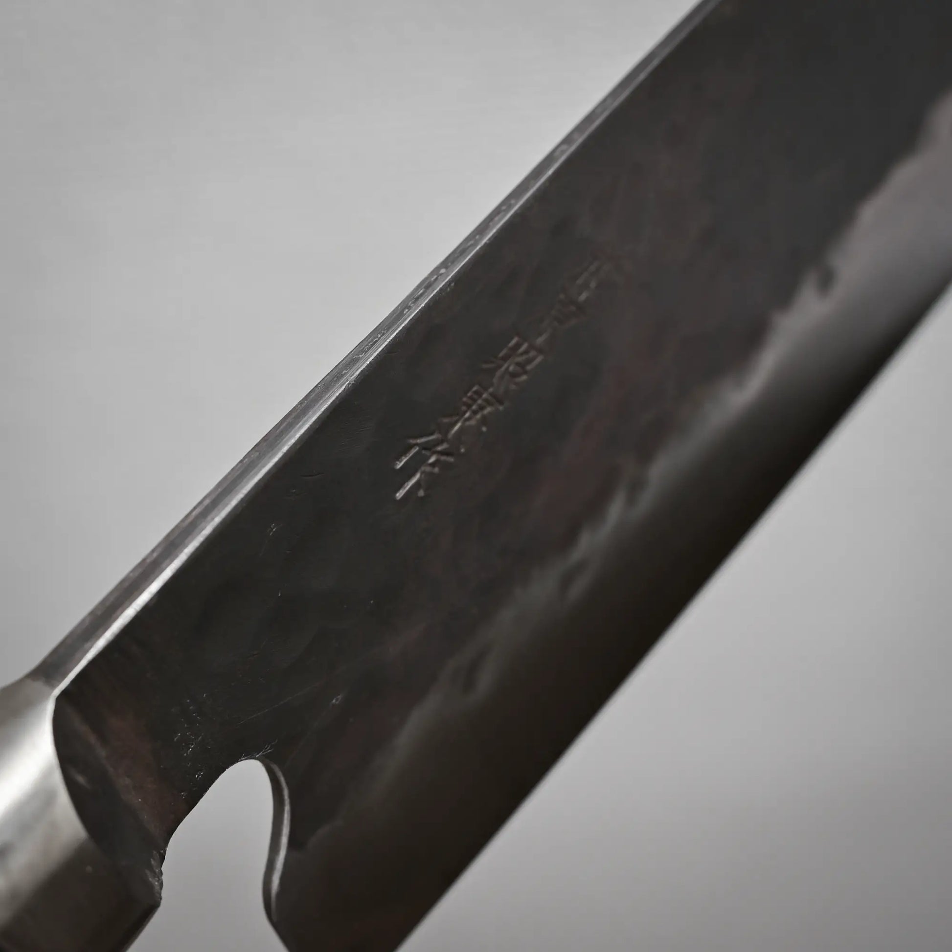 Close-up view of the spine of 165mm Teruyasu Fujiwara Denka nakiri knife