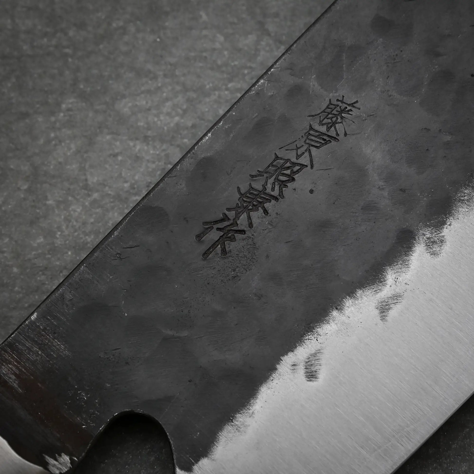 Close-up view of the maker's mark on 165mm Teruyasu Fujiwara Denka nakiri knife