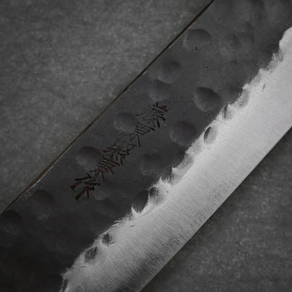 Close-up view of the maker's mark on 240mm Teruyasu Fujiwara Denka sujihiki knife