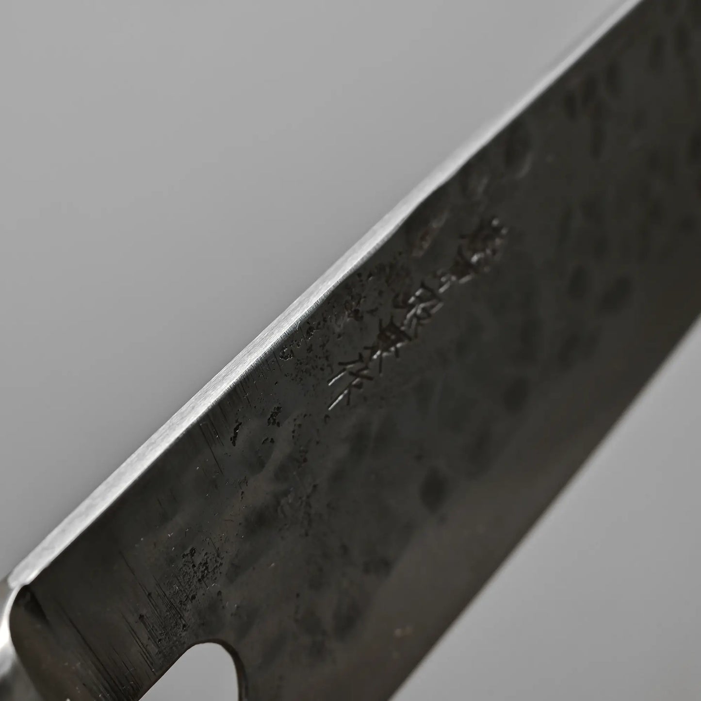 Close-up view of the spine of 240mm Teruyasu Fujiwara Maboroshi shirogami#1 gyuto knife