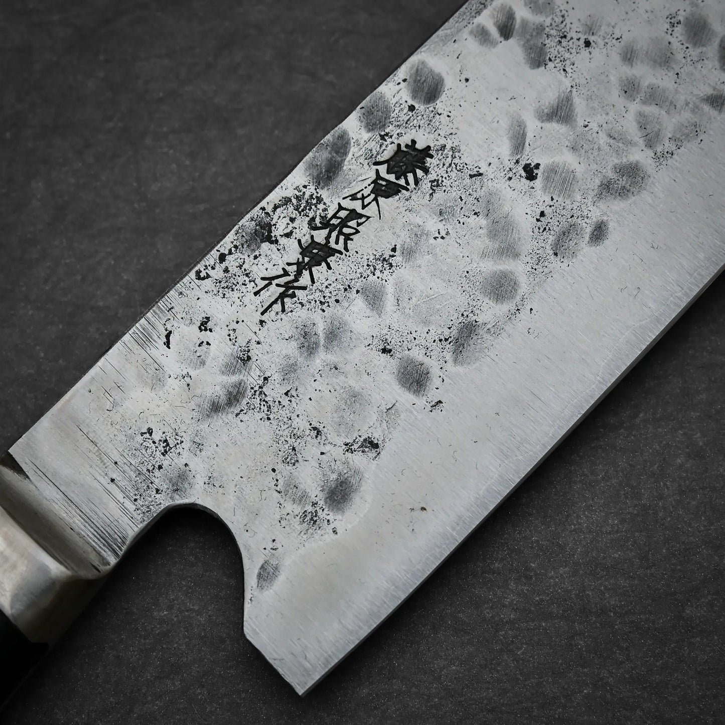 Close-up view of the maker's mark on 240mm Teruyasu Fujiwara Maboroshi shirogami#1 gyuto knife