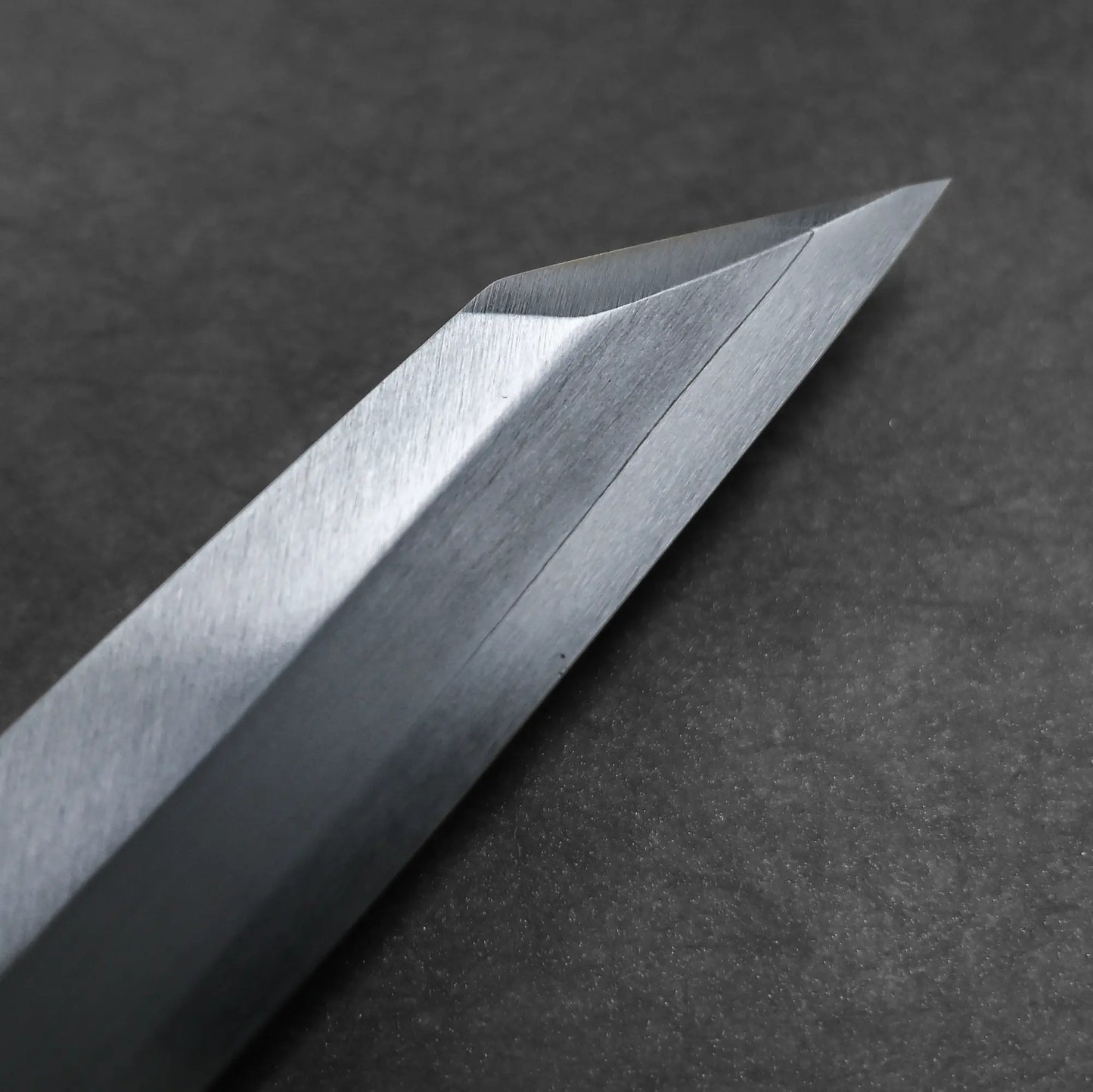 Close-up shot of the tip of Tsunehisa knife ginsan 300mm kiritsuke yanagiba