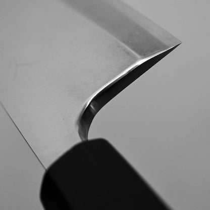 Close-up shot of the high polish on the choil of Tsunehisa knife ginsan 165mm deba