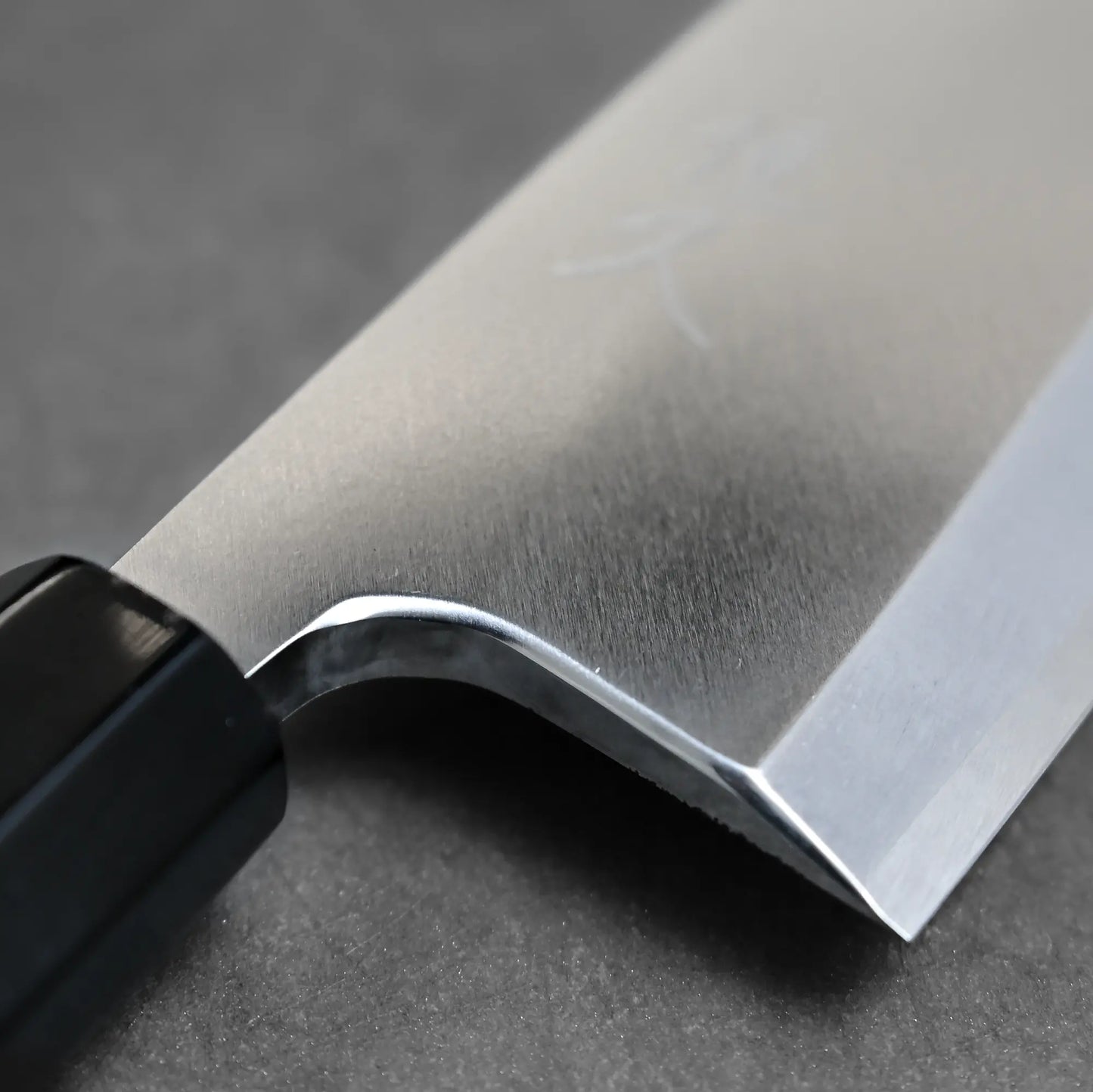 Close-up shot of the choil on Tsunehisa knife ginsan 165mm deba