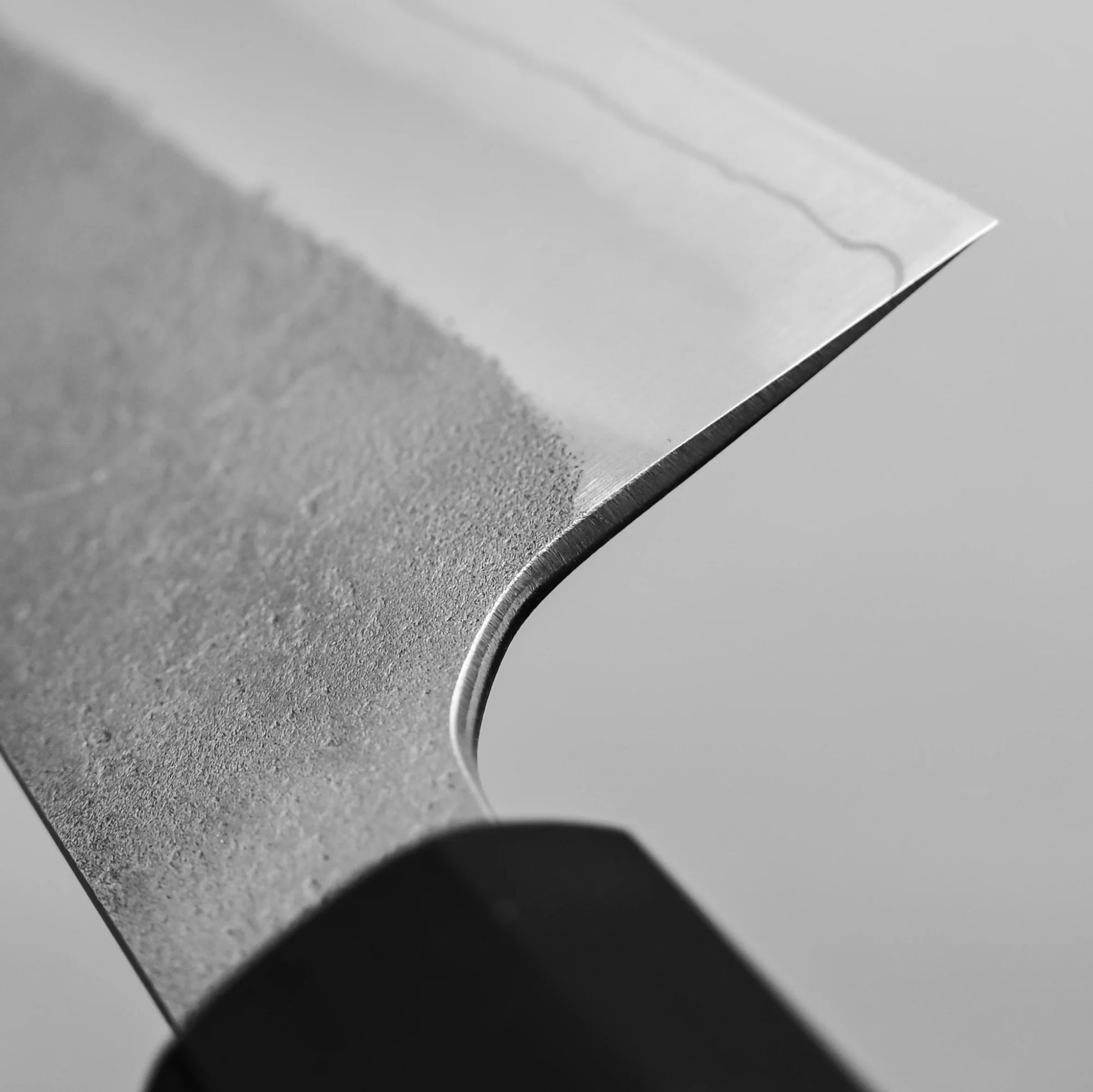 Close-up view of the choil of 240mm Hatsukokoro x Yoshikane nashiji SKD gyuto knife