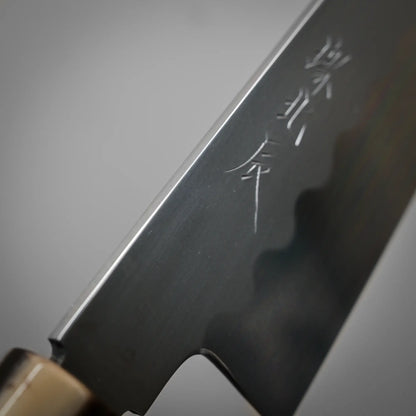 Close-up view of the spine of 240mm Yoshikazu Ikeda shirogami#3 honyaki gyuto knife