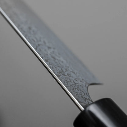 Close-up shot of the spine of 270mm Yoshimi Kato knife damascus VG10 sujihiki