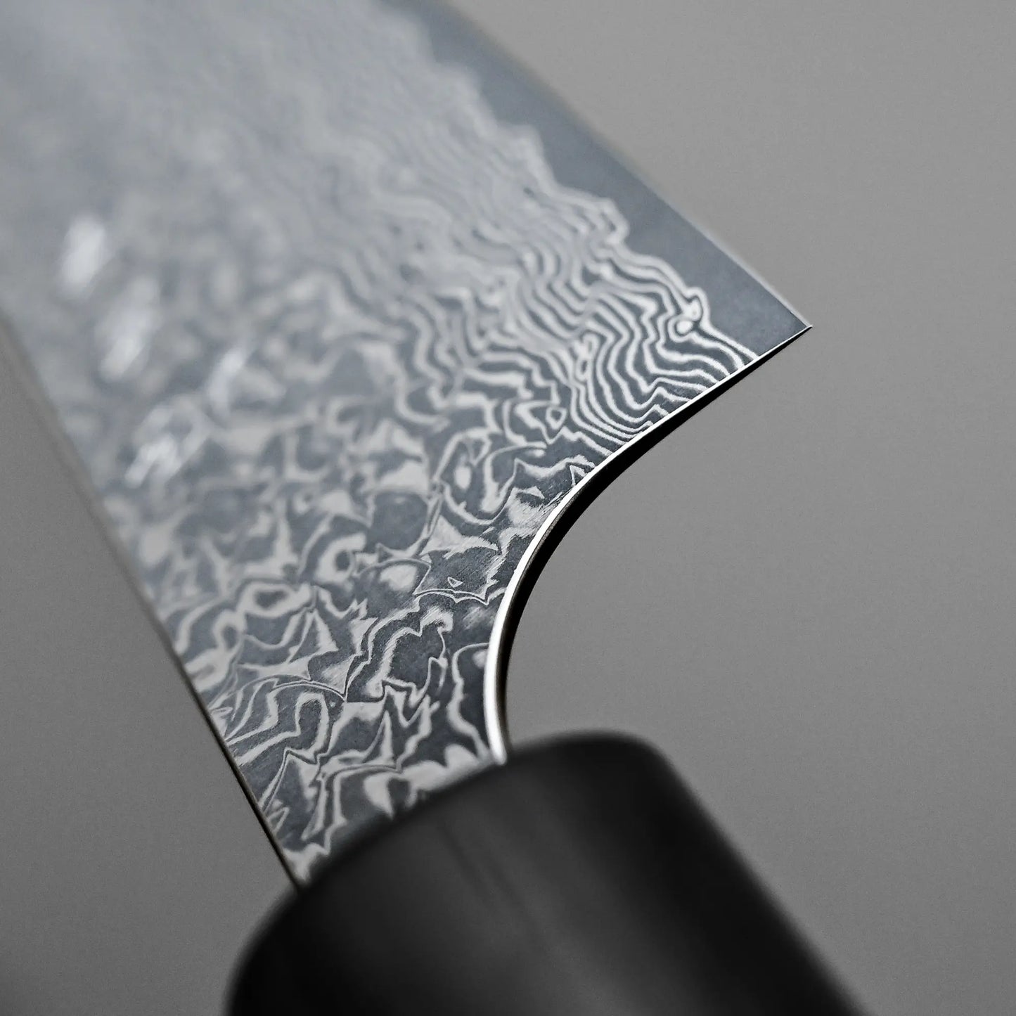 Close-up shot of the choil of 270mm Yoshimi Kato knife damascus VG10 sujihiki