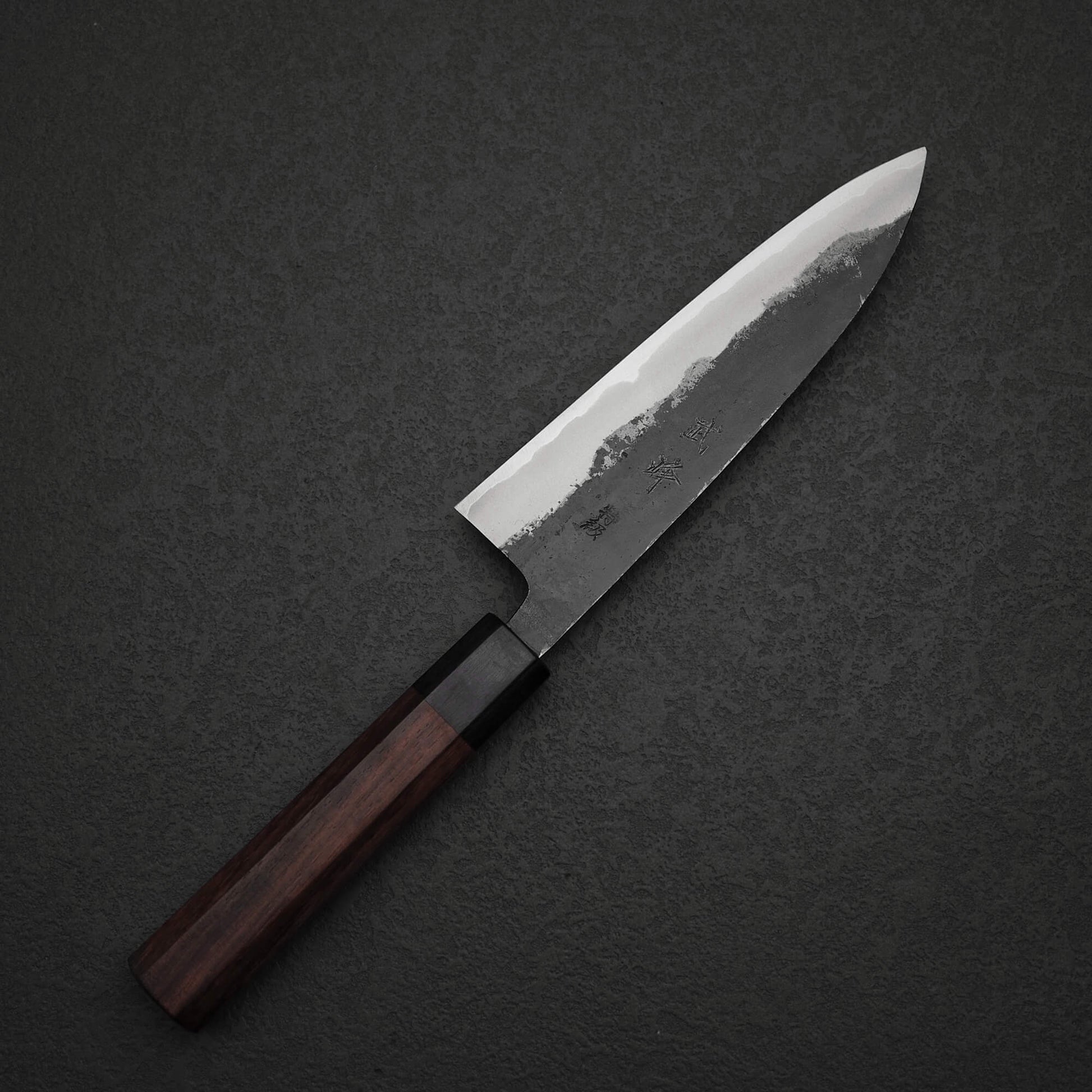 Top view of Murata Buho kurouchi aogami#1 funayuki knife. Image shows the left side of the knife.