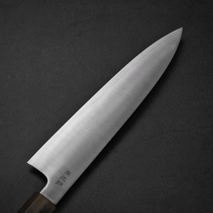 Top view of Sukenari HAP40 240mm gyuto. Image focuses on the left side of the blade