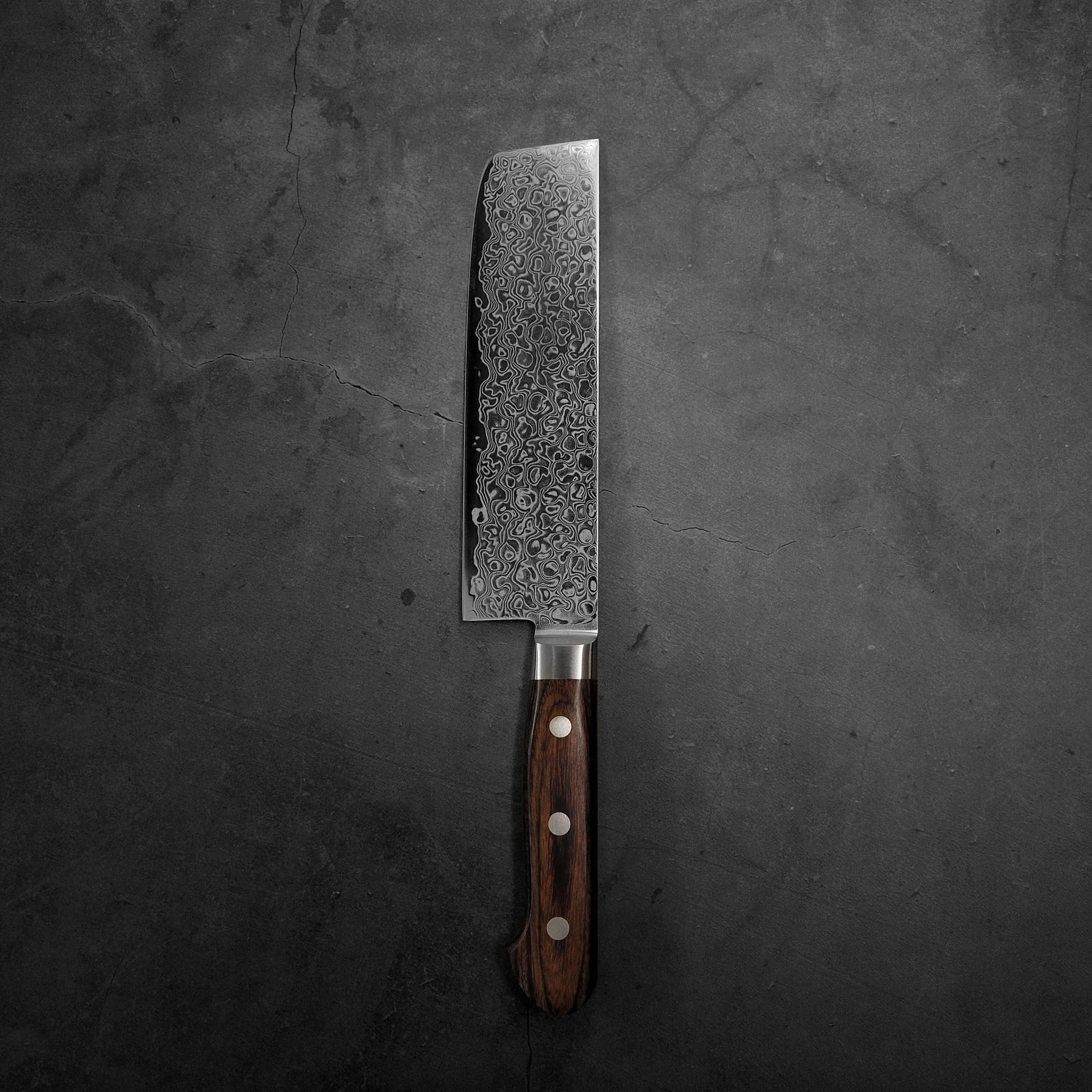 Top view of Tsunehisa ZA18 damascus nakiri knife. Image shows the left side of the blade
