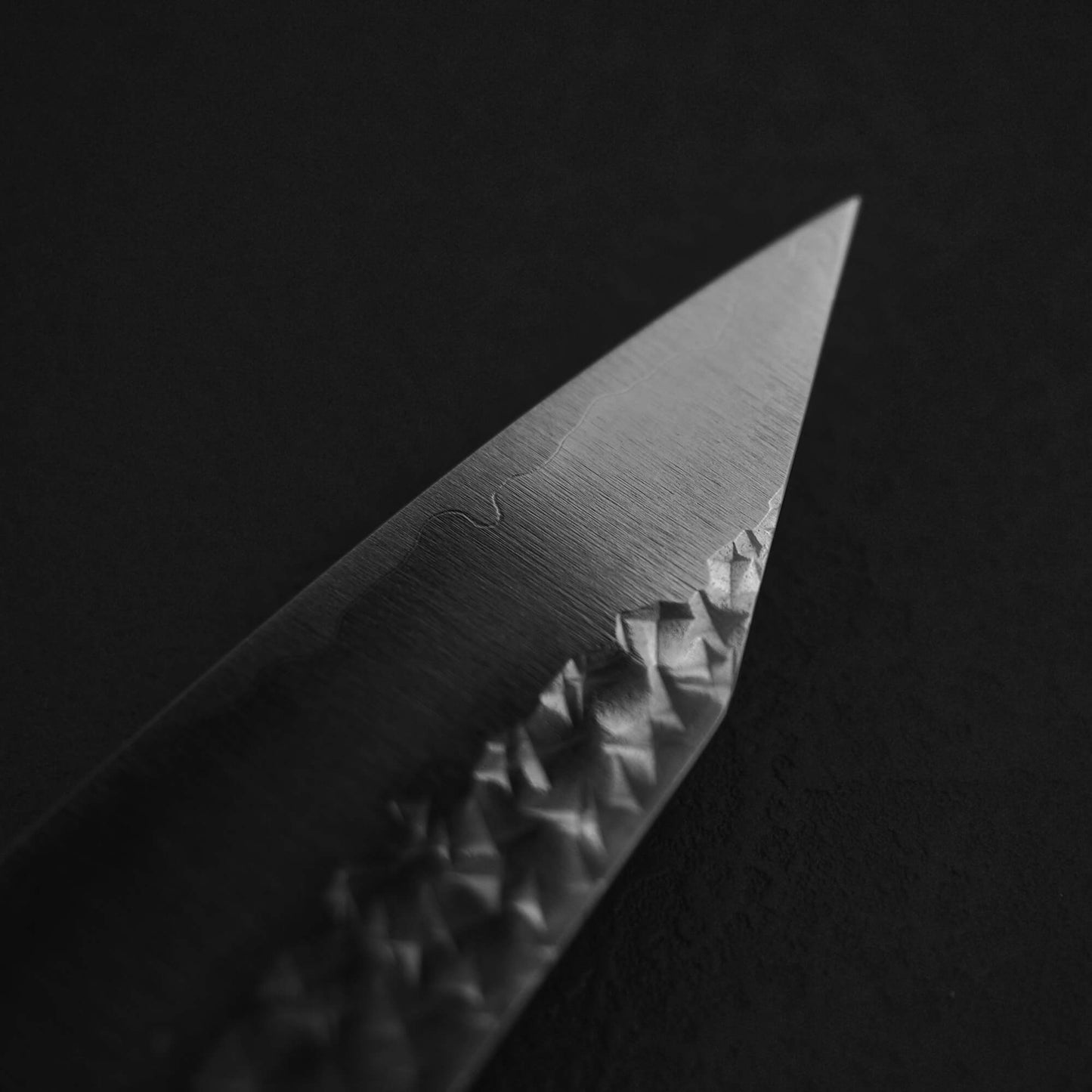 Close up view of the tip on the back side of Yu Kurosaki SG2 Senko kiritsuke gyuto 210mm