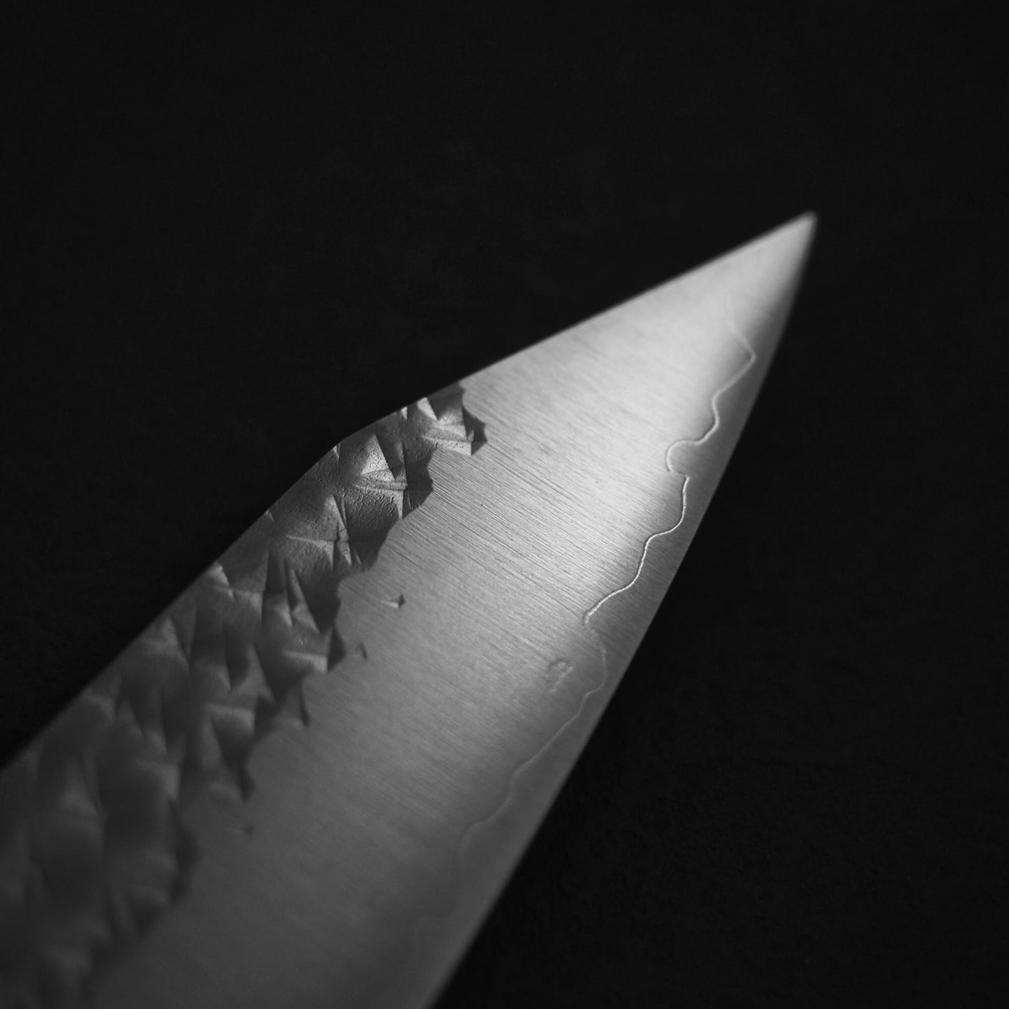 Close up view of the tip on the front blade of Yu Kurosaki SG2 Senko kiritsuke gyuto 210mm